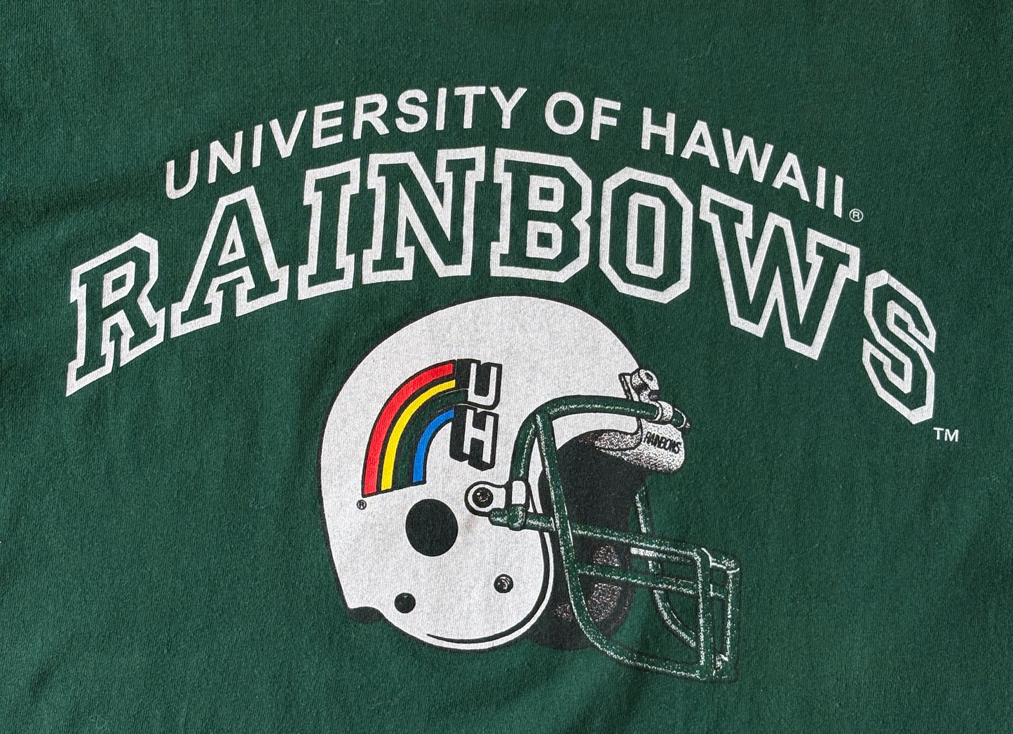 Vintage University of Hawaii Rainbows tee – bold NCAA football style with retro rainbow helmet graphic. Med