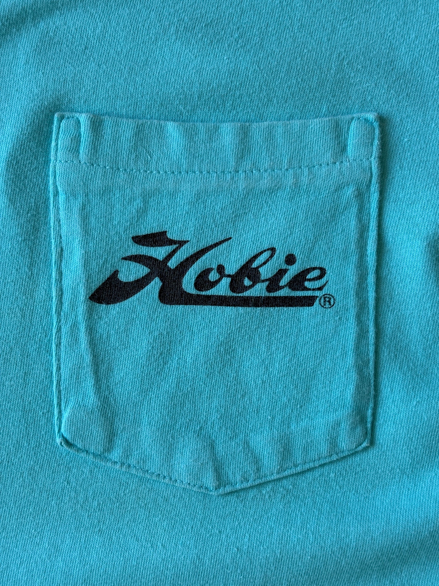 Vintage Hobie Cat sailing tee – vibrant 80s beach scene with colorful catamarans. Large