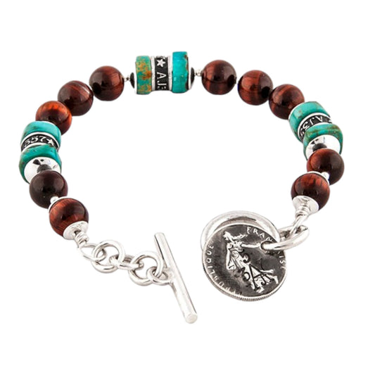 The Pacific Bracelet is made of, Turquoise, sterling silver, Vintage silver coin and Red Tiger eye 8mm Beads.