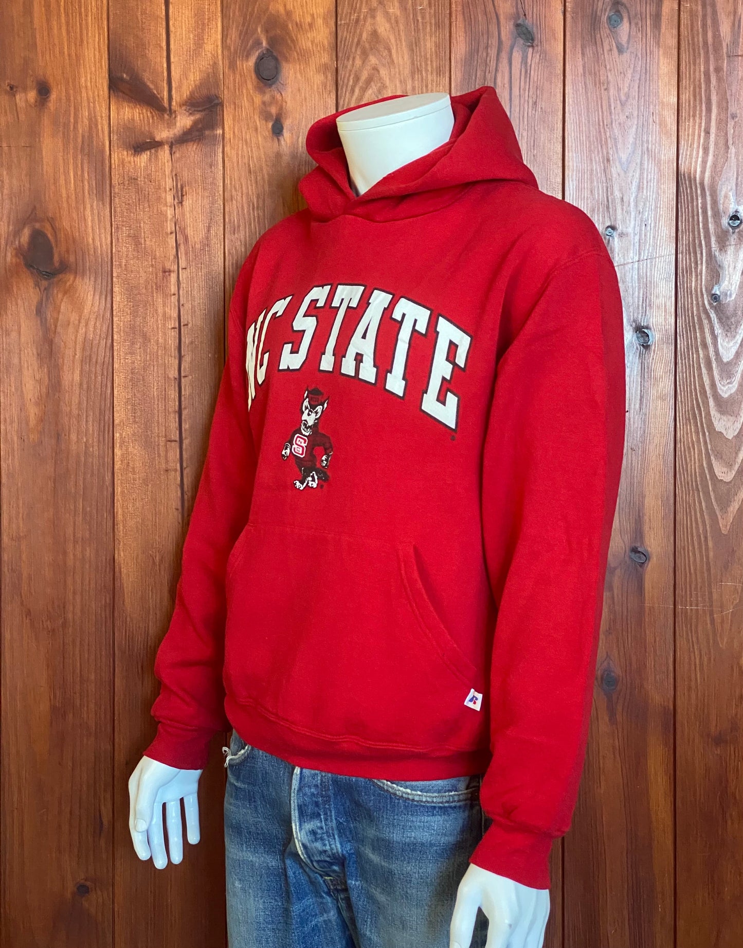 Size M. Vintage NC State 90s hooded sweatshirt made by Russell Athletic