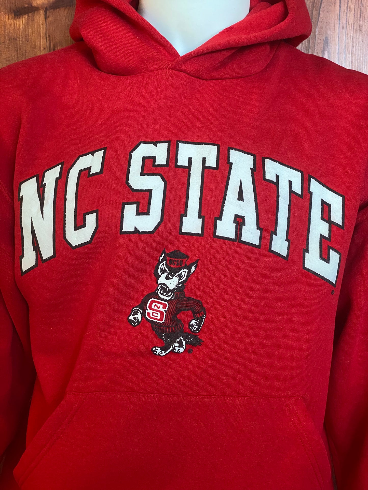 Size M. Vintage NC State 90s hooded sweatshirt made by Russell Athletic