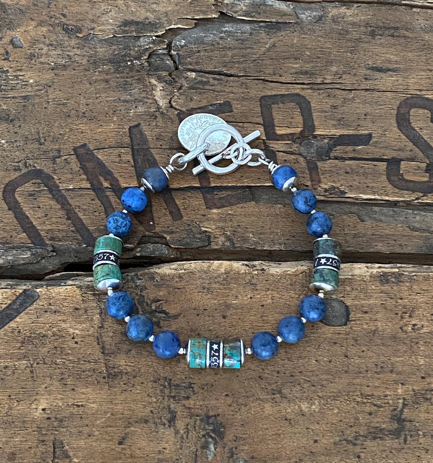 The Pacific Bracelet is made of, Turquoise, sterling silver, Vintage coin and Dumortierite 8mm Beads.