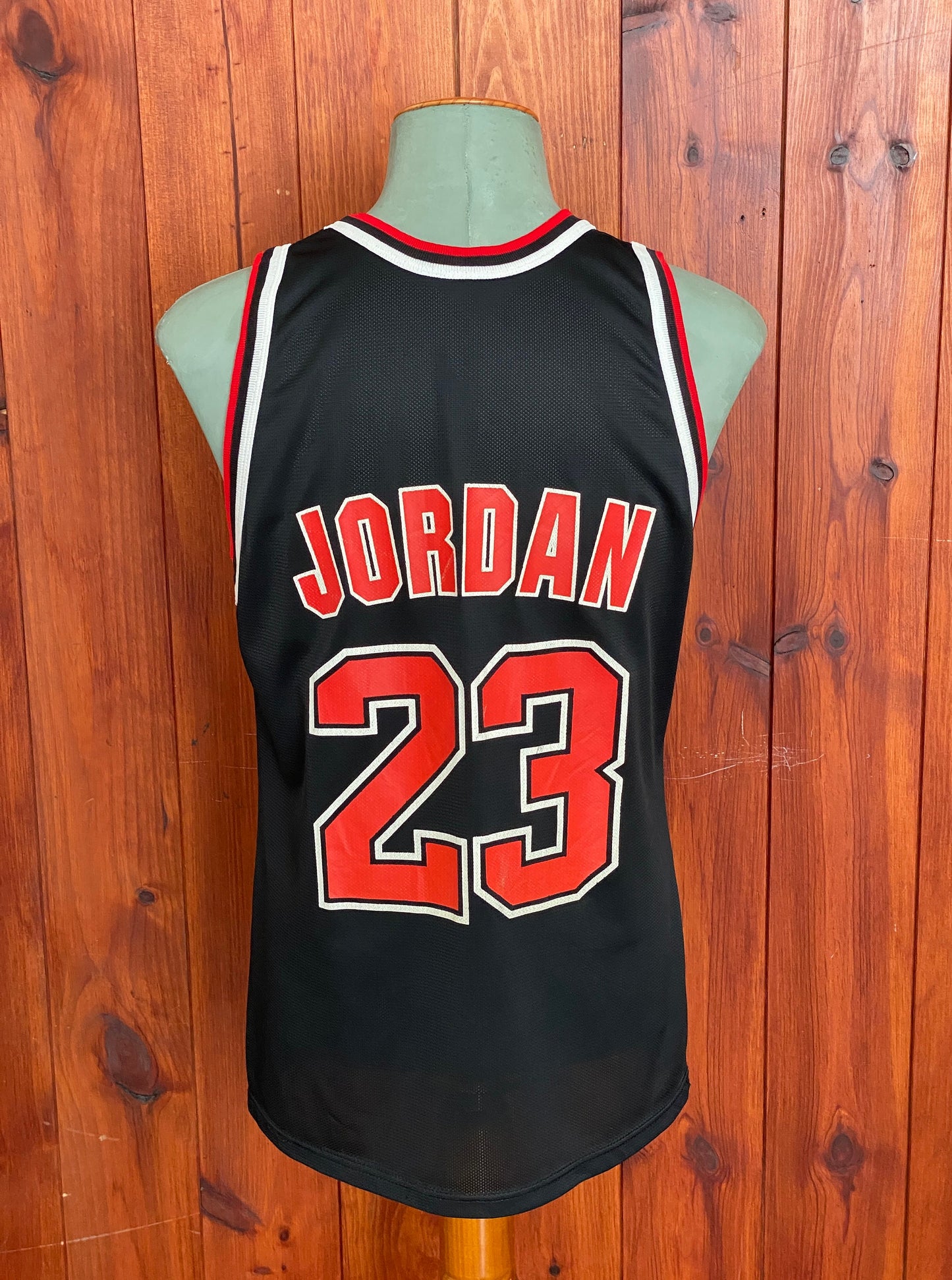 Vintage 90s NBA Chicago Bulls Michael Jordan #23 jersey, size 44 - back view. Made in USA by Champion.