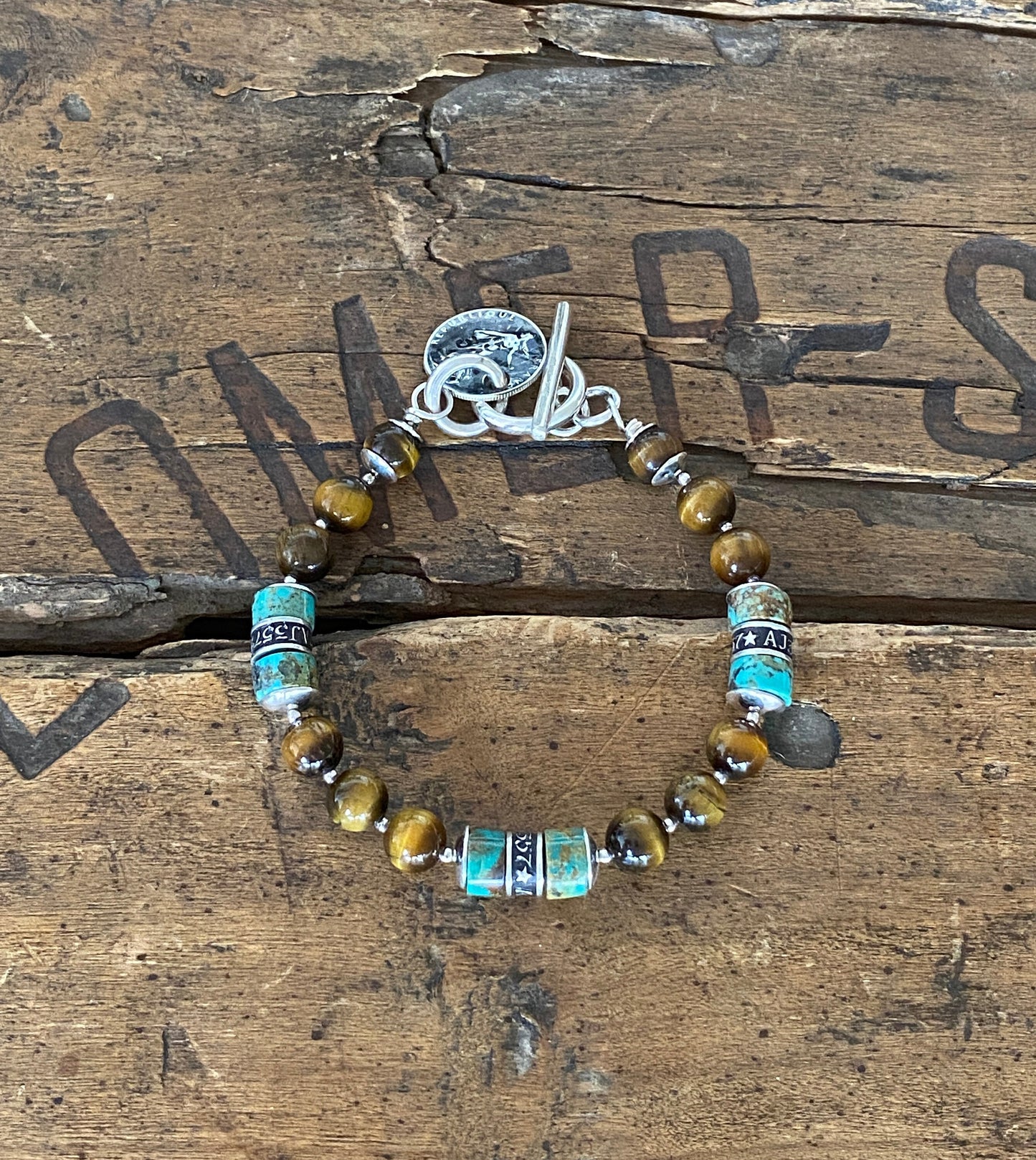 The Pacific Bracelet is made of, Turquoise, sterling silver, Vintage coin and Tiger eye 8mm Beads.