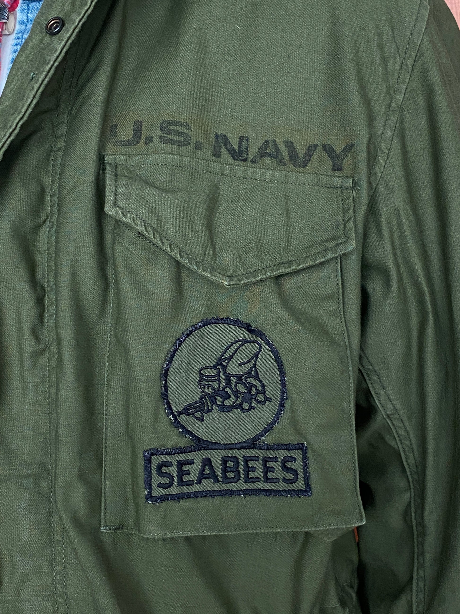 Authentic 1972 Vietnam Era US Navy Seabee Vintage M-65 Field Jacket: Classic Military Apparel with Rich History.