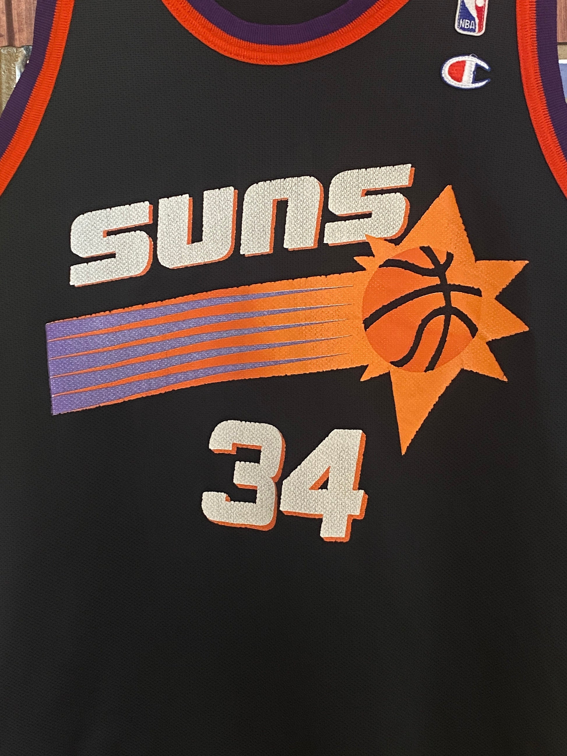 Vintage 90s NBA Phoenix Suns Charles Barkley #34 jersey, size 44 - front view. Made by Champion.