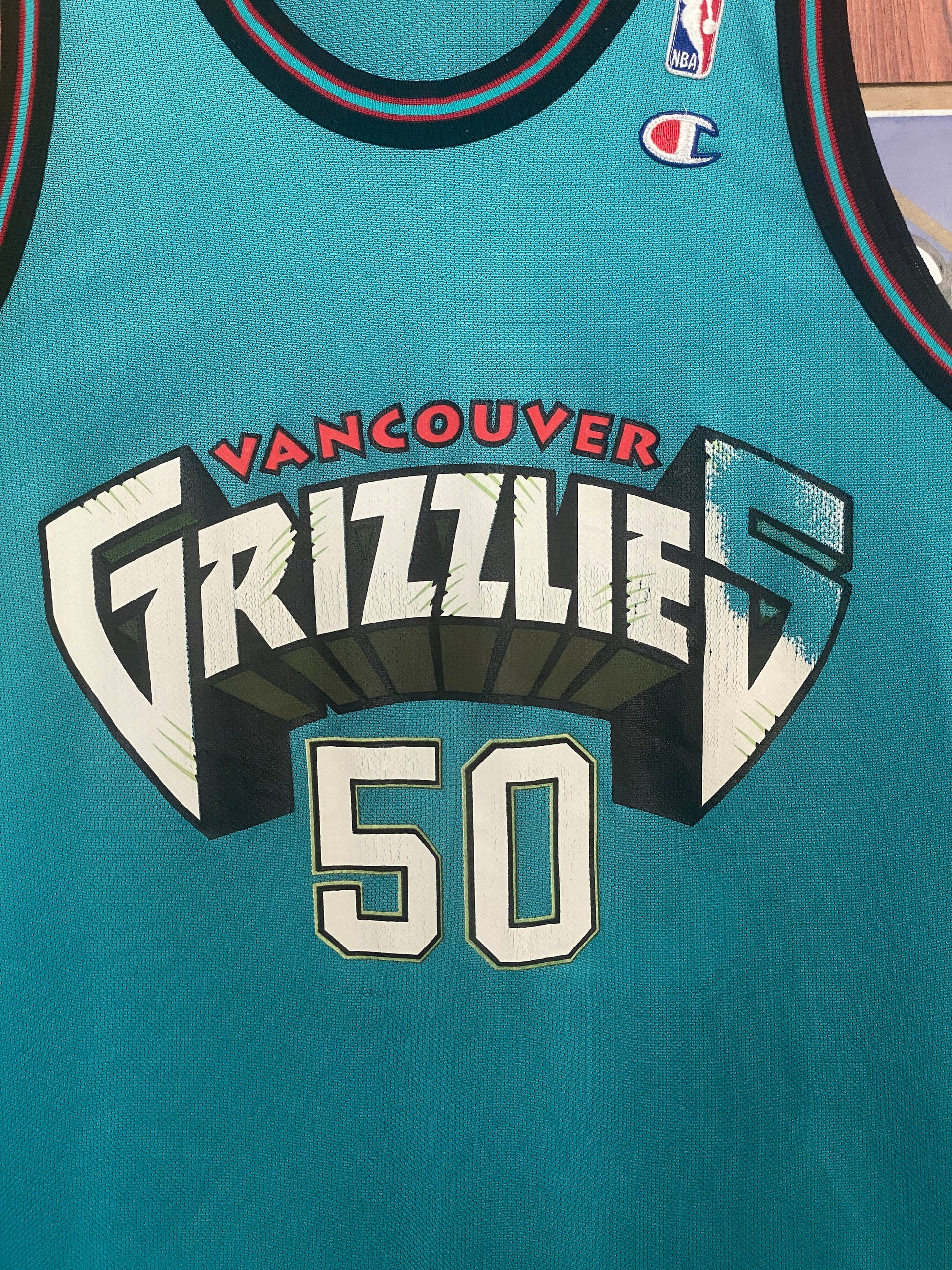 Vintage 90s NBA Grizzlies Bryant Reeves #50 Champion jersey, size 44 - front view.