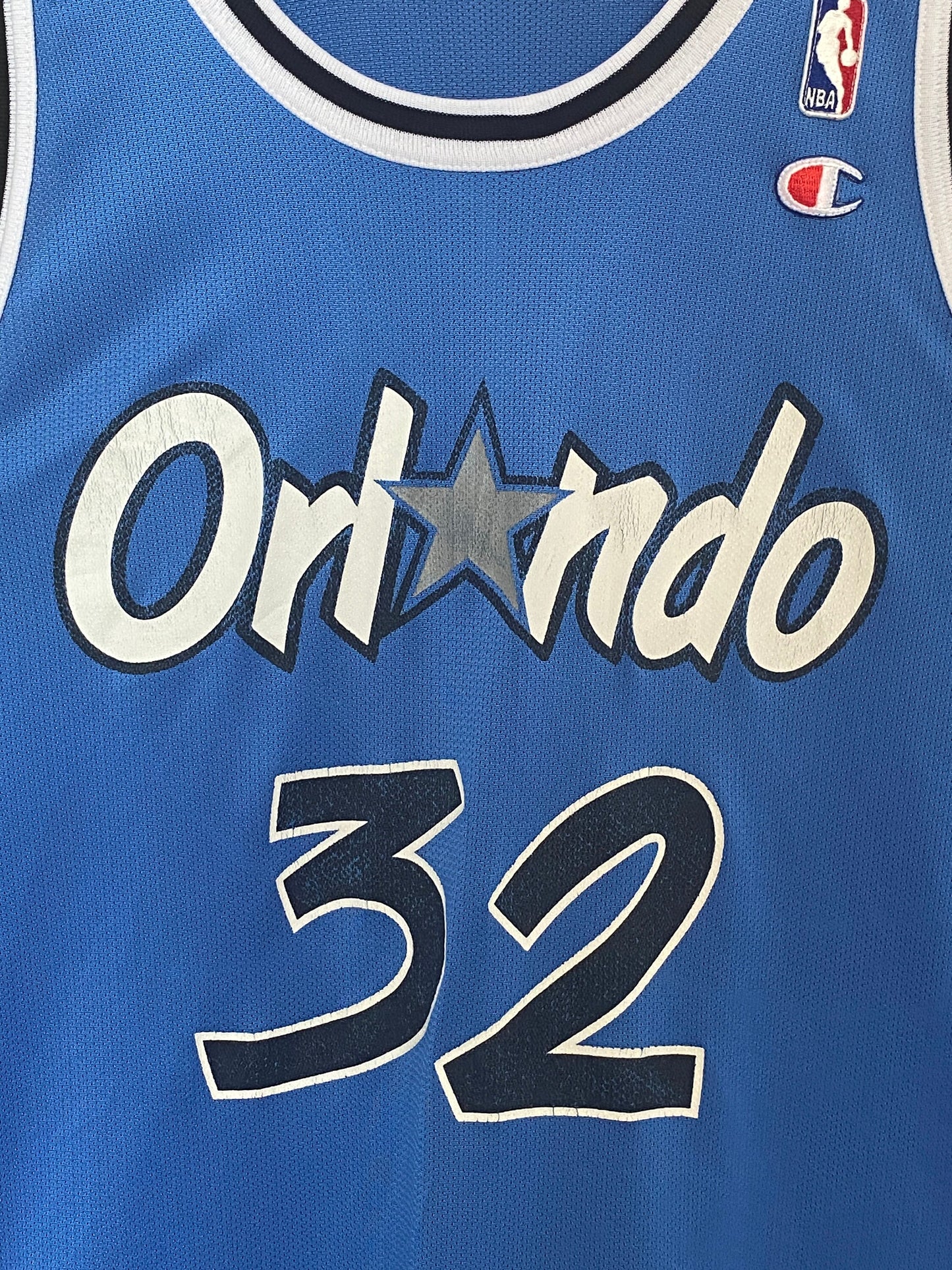 Vintage 90s Orlando NBA jersey with player O'Neal #32, size 48 - front view. Made by Champion.