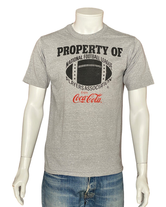 Vintage 80s "Property of Coca Cola" T-shirt, 50/50 cotton, made in the USA, size Medium - Retro style and timeless comfort.