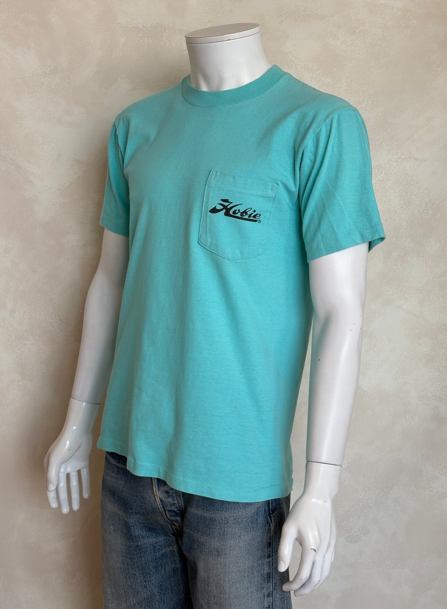 Vintage Hobie Cat sailing tee – vibrant 80s beach scene with colorful catamarans. Large