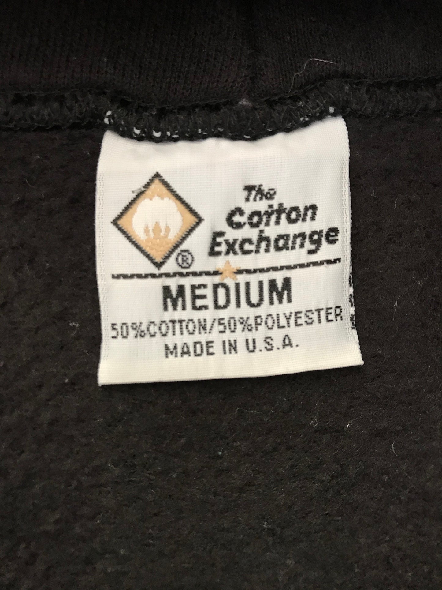 Vintage hooded sweatshirt made in the USA by The Cotton Exchange, size M - Classic American style and quality craftsmanship.