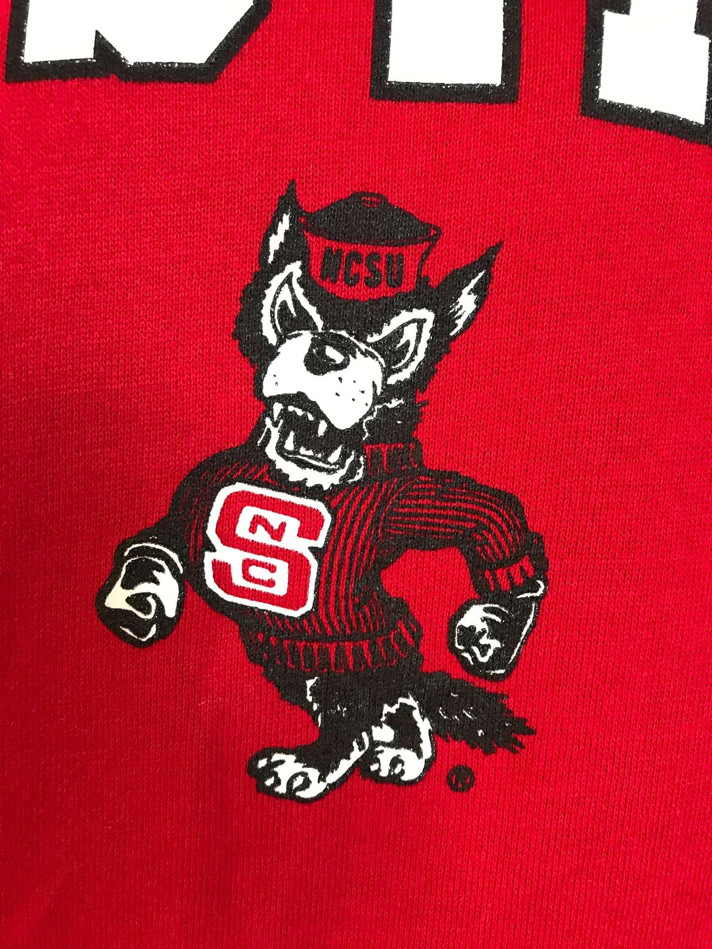 Size M. Vintage NC State 90s hooded sweatshirt made by Russell Athletic