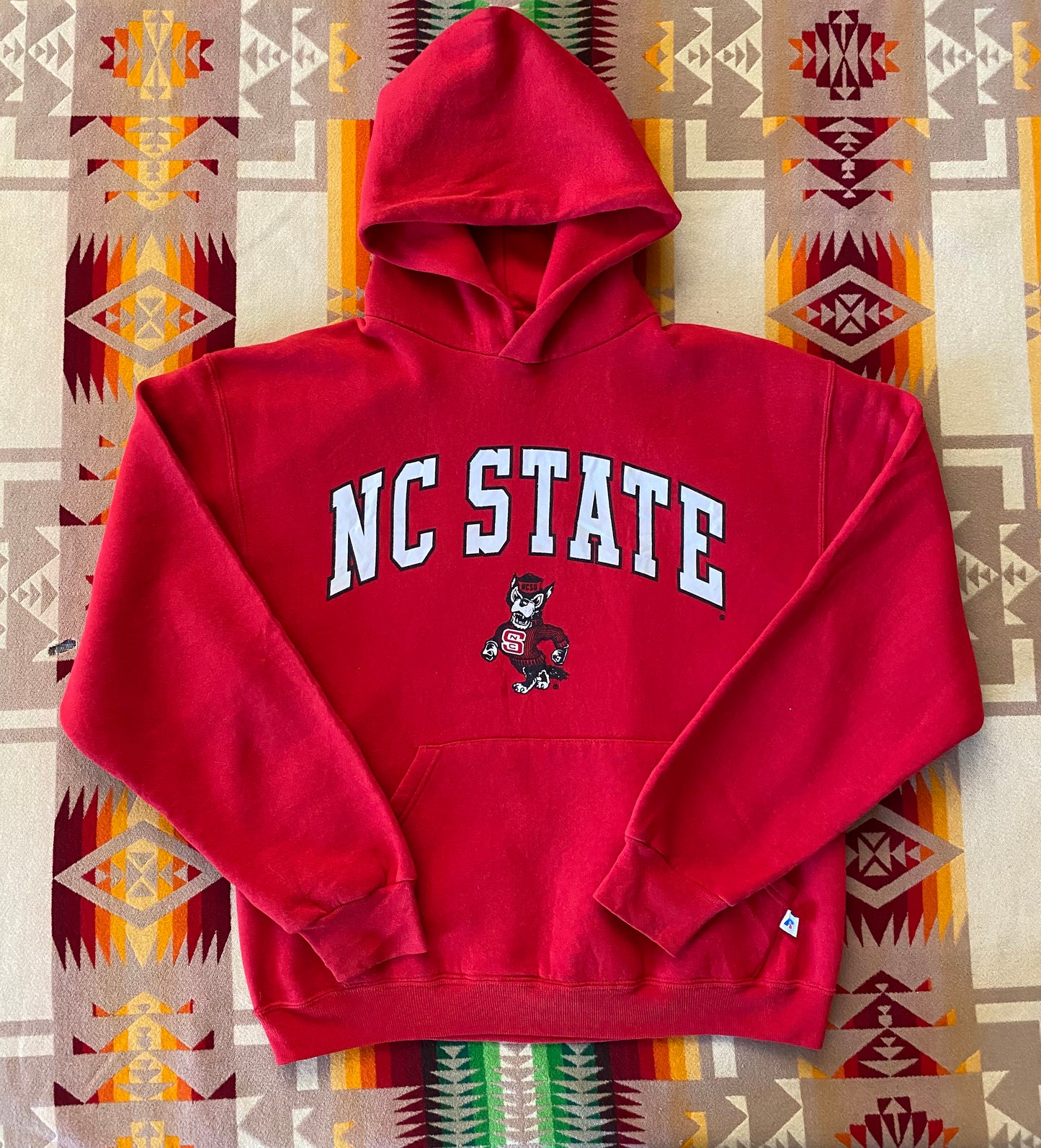 Size M. Vintage NC State 90s hooded sweatshirt made by Russell Athletic