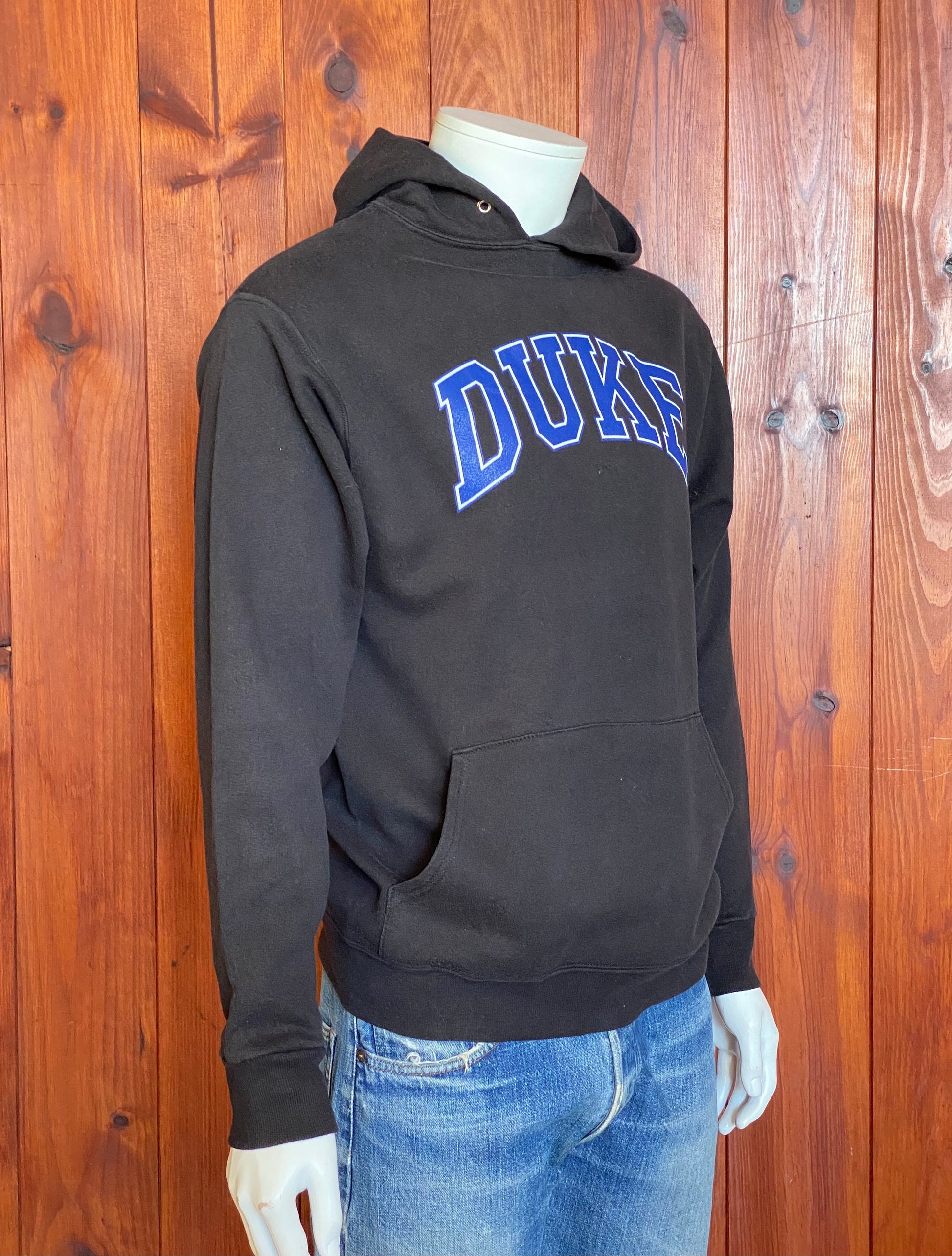 Vintage hooded sweatshirt made in the USA by The Cotton Exchange, size M - Classic American style and quality craftsmanship.