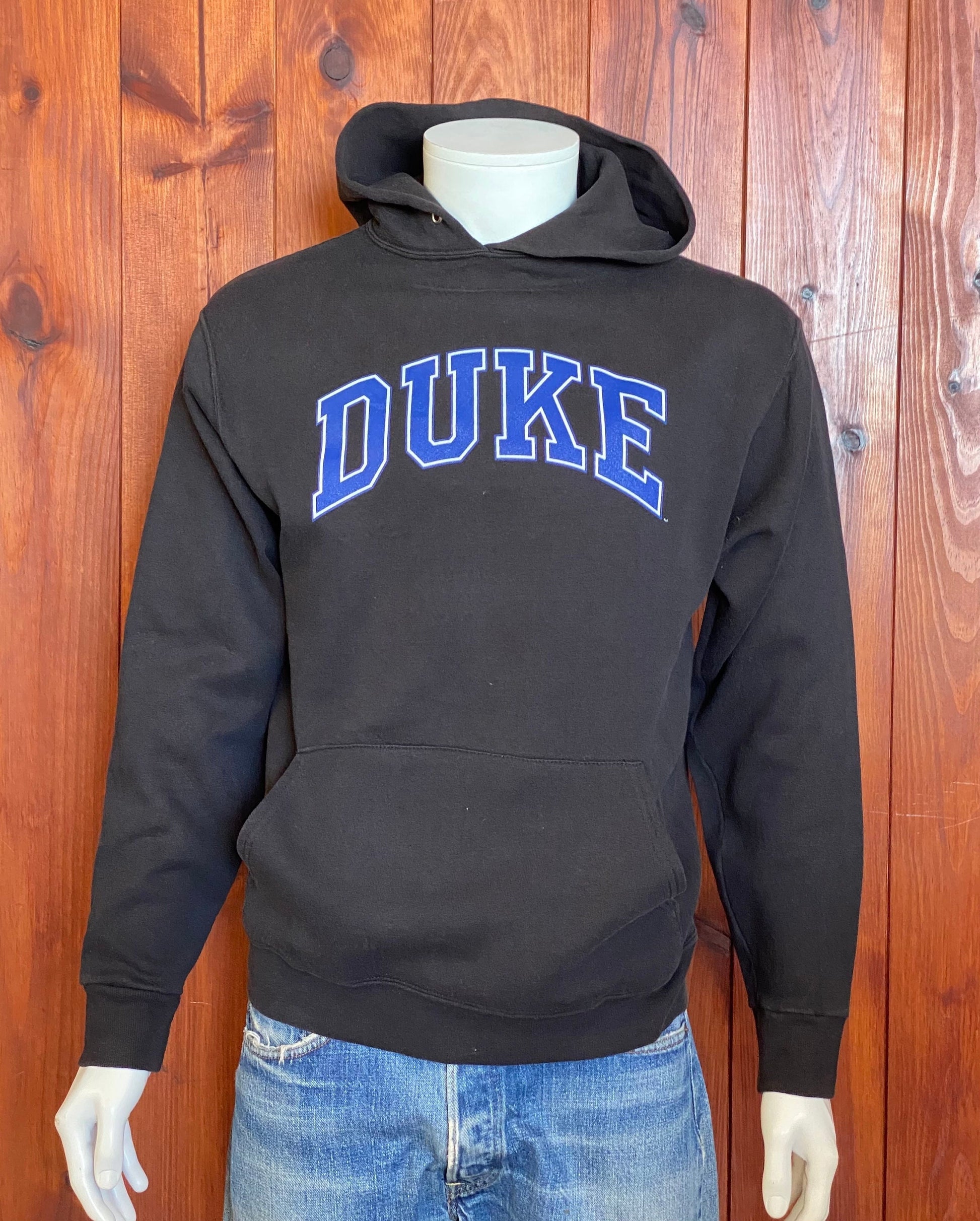 Vintage hooded sweatshirt made in the USA by The Cotton Exchange, size M - Classic American style and quality craftsmanship.