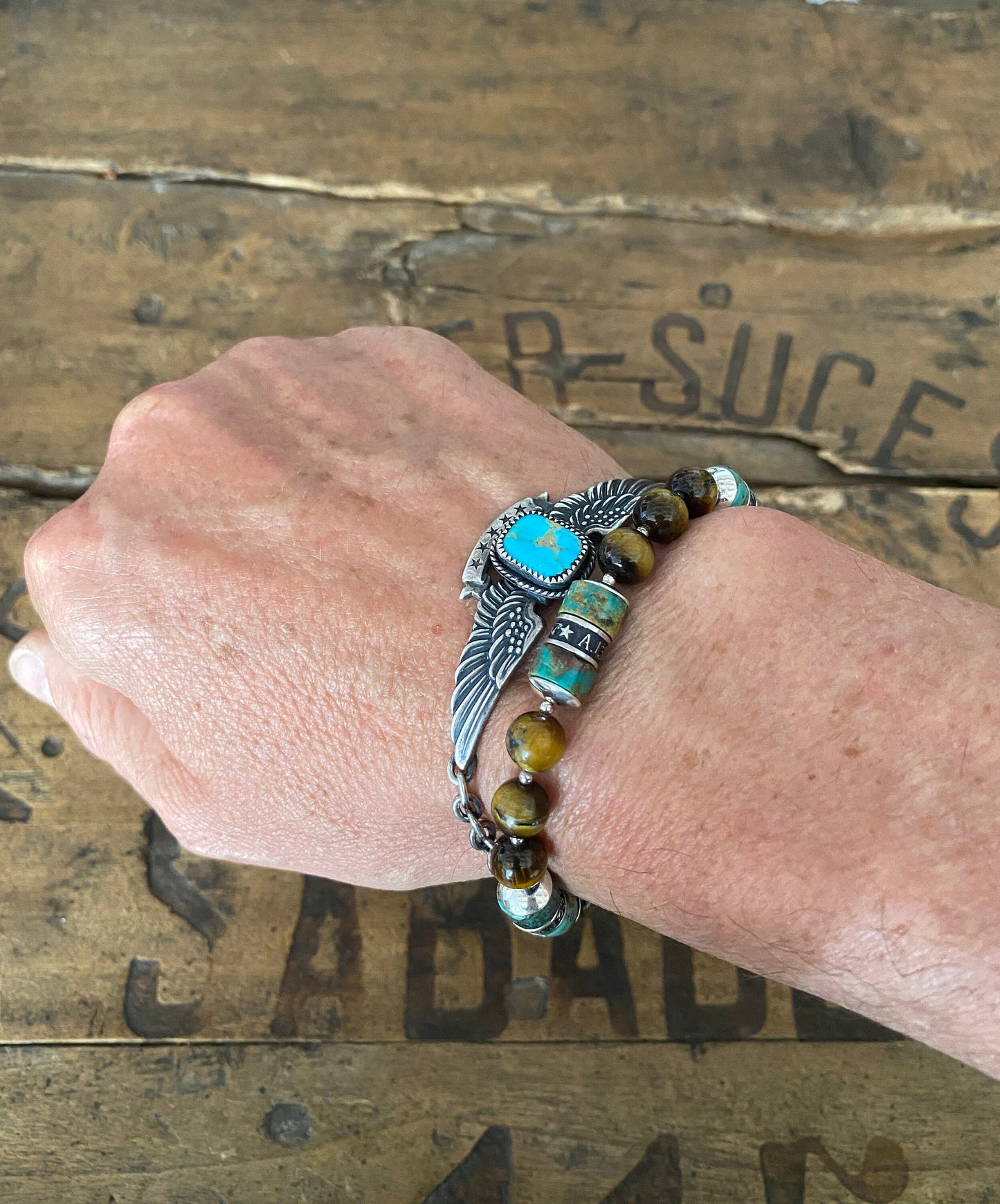 The Pacific Bracelet is made of, Turquoise, sterling silver, Vintage coin and Tiger eye 8mm Beads.