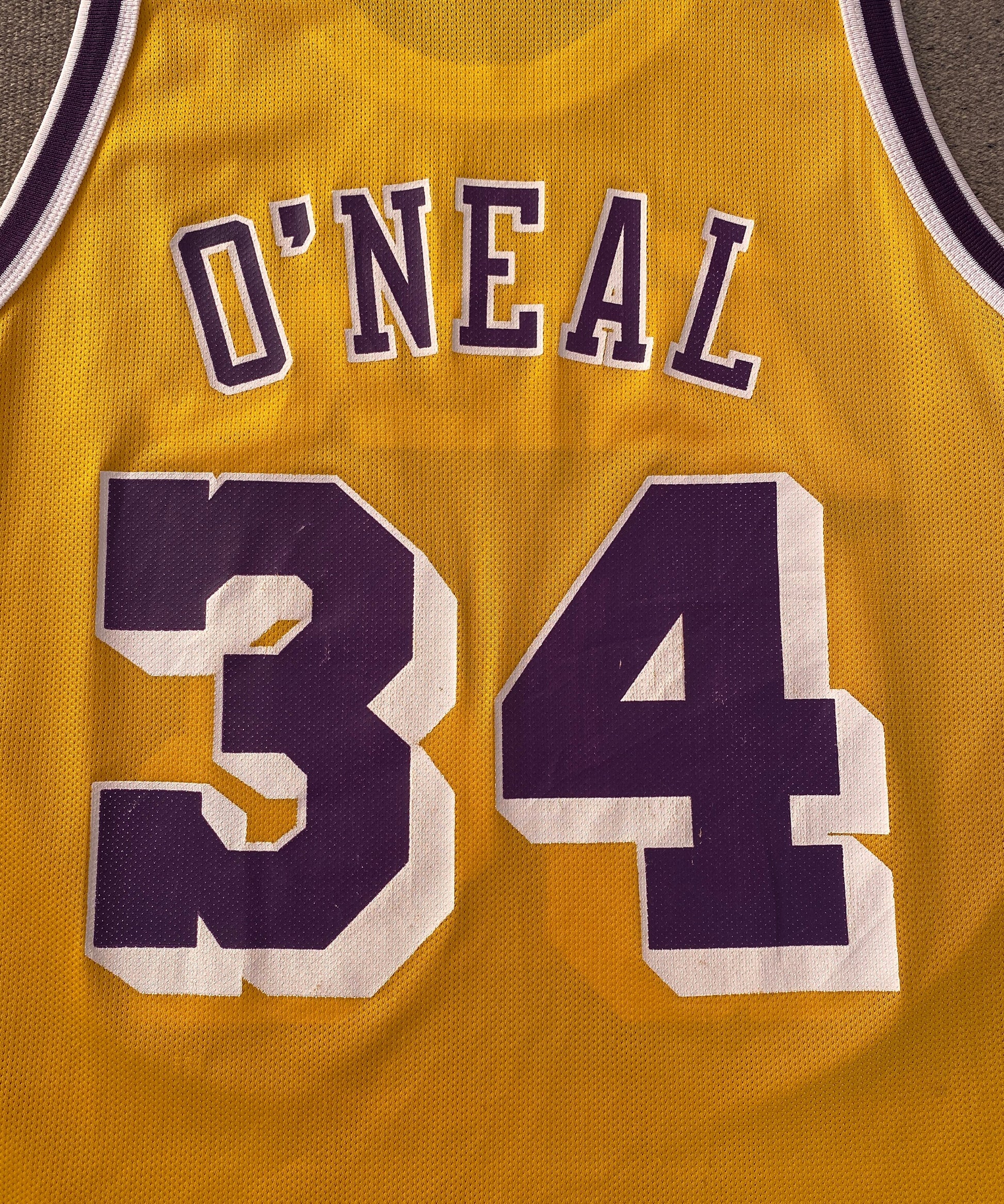 Vintage NBA Champion jersey LA Lakers with player O'Neal #34, size 44 - back view.