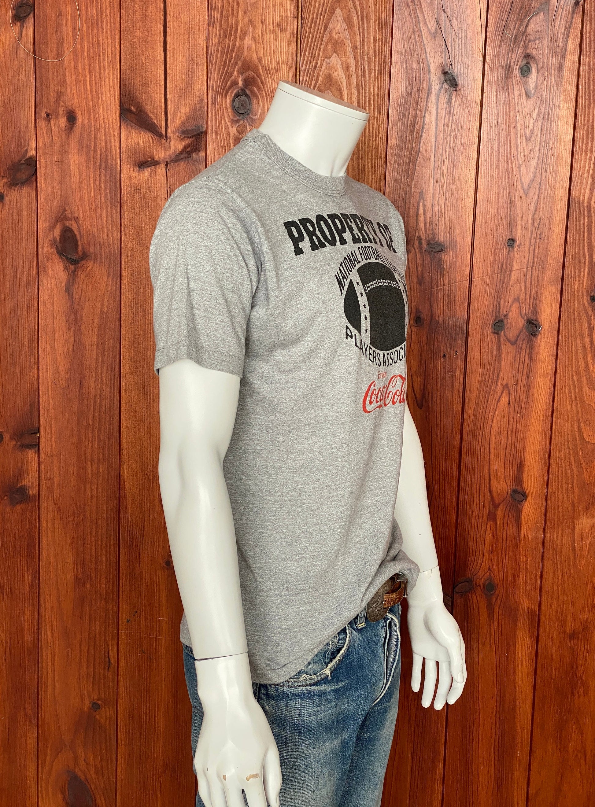 Vintage 80s "Property of Coca Cola" T-shirt, 50/50 cotton, made in the USA, size Medium - Retro style and timeless comfort.