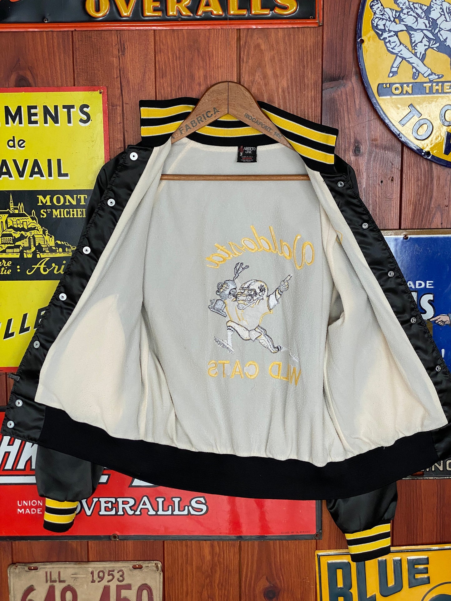 Vintage 80s football satin jacket made in USA, size medium - Retro style and durable craftsmanship for your wardrobe.